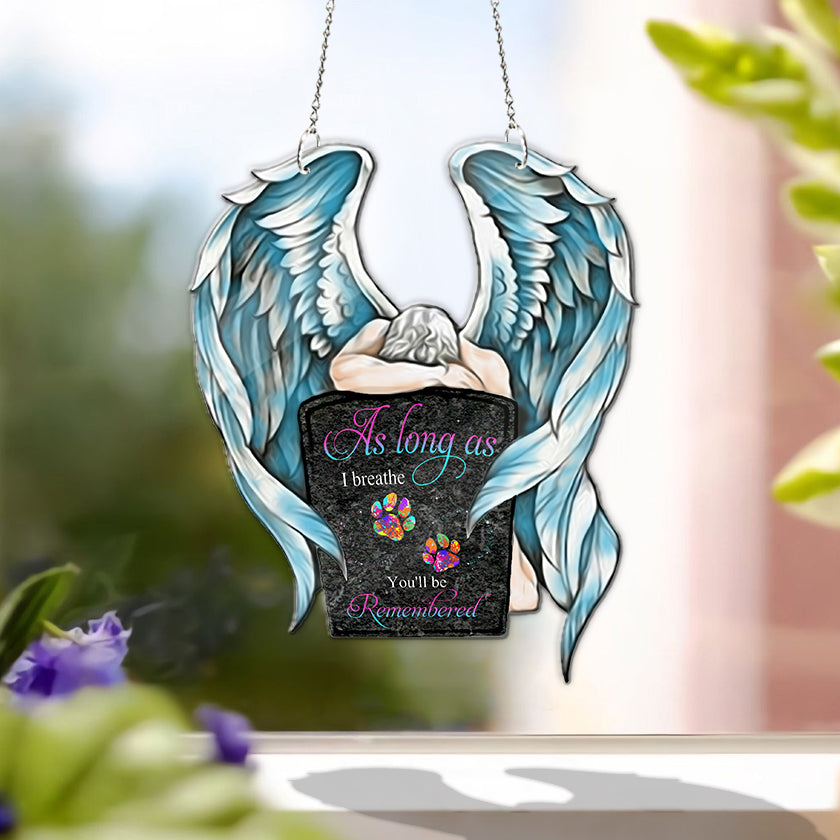 Personalized in loving memory suncatcher hanging in a sunlit window