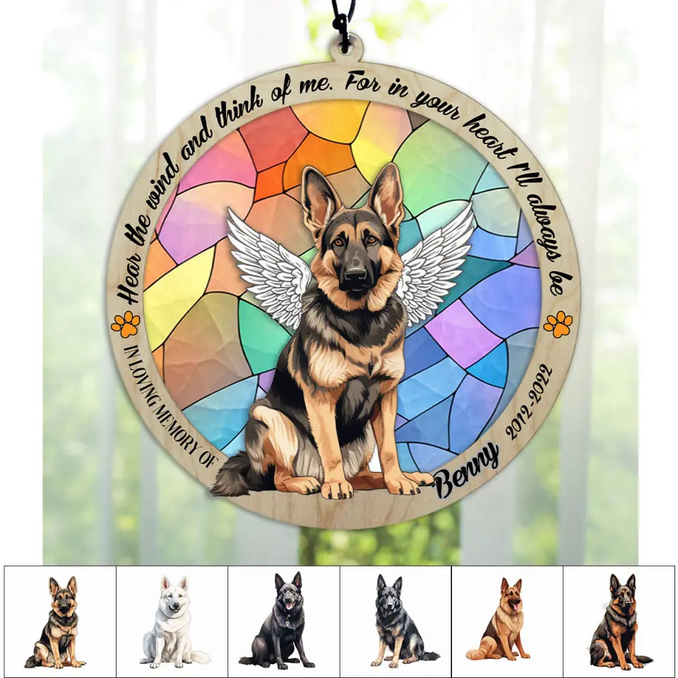 Personalized German Shepherd memorial suncatcher with pet name displayed in a window.