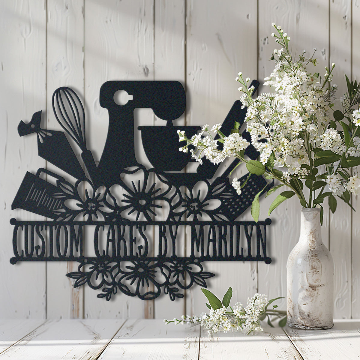 Baking Lovers metal wall art displayed on a home wall