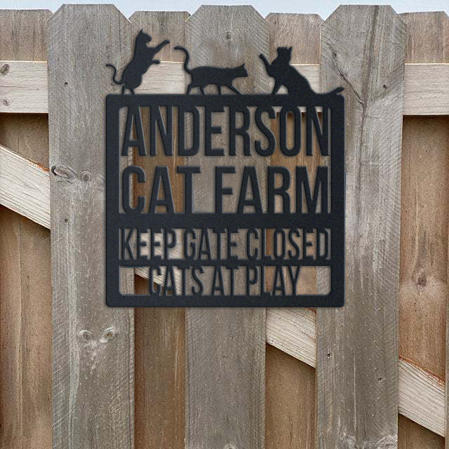 Cat Lovers metal sign displayed as wall decor